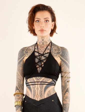 black crop top tribal bra with lacing strap on bare back & V-neck Exception  Zuma